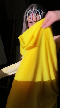 Belly Dancer Posing with Albino Python in Dark Studio