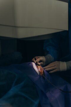 Surgeon performing lasik eye surgery on patient