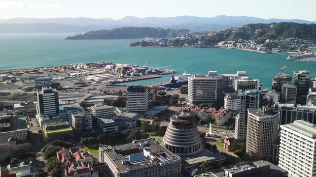 Beehive and New Zealand Parliament buildings with seaside drone panorama. Wellington