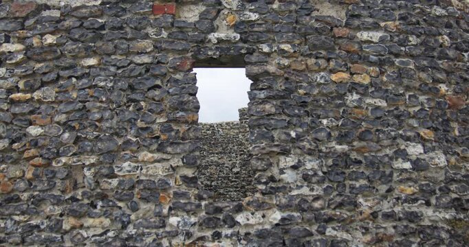 Show zoom in on to a window Opening at Neptune's Temple, tower at kinggate bay.