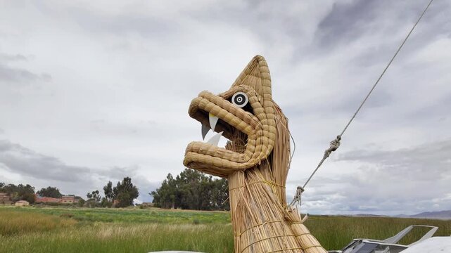 Traditional Totora Reed Boat with Puma Head Detail on Lake Titicaca, Bolivia