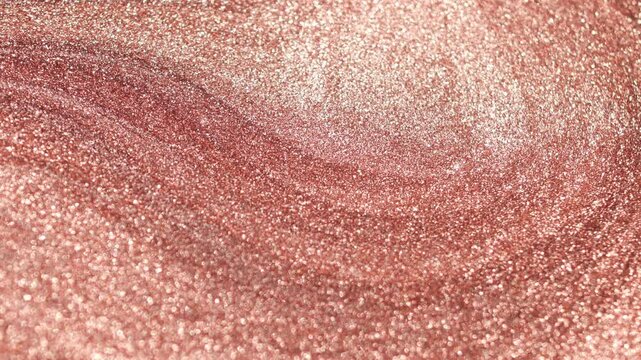 Detailed macro view of copper paint with a sandy texture rotating slowly and sparkling with radiant glitter particles