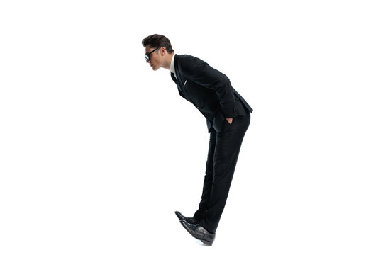 Side view of curious man leaning forward