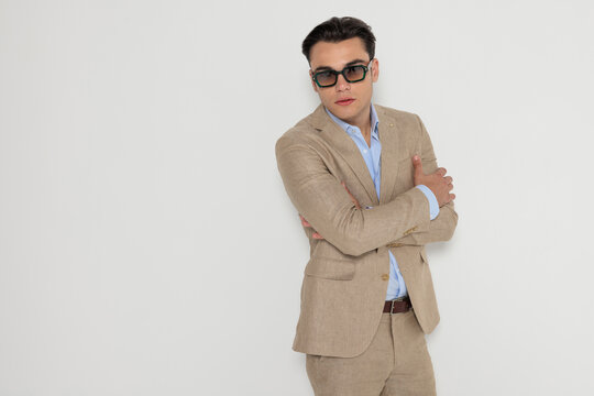 Stylish man with crossed arms posing