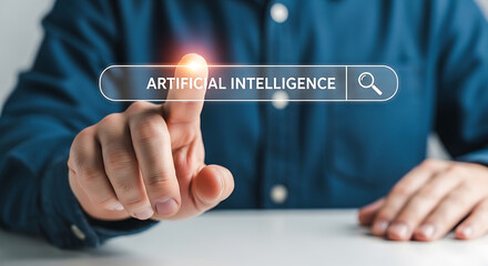 Obraz premium A man in a blue shirt interacting with an artificial intelligence search bar on a computer screen with his finger