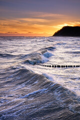 Fototapeta premium Dramatic Winter Storm Waves at Koserow Beach Sunrise