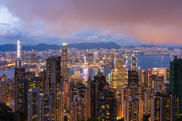 View of Hong Kong and Kowloon from Victoria peak. Evening, sunset. Panorama of Hong Kong, skyscrapers and nature. 21 May 2025, Hong Kong, China