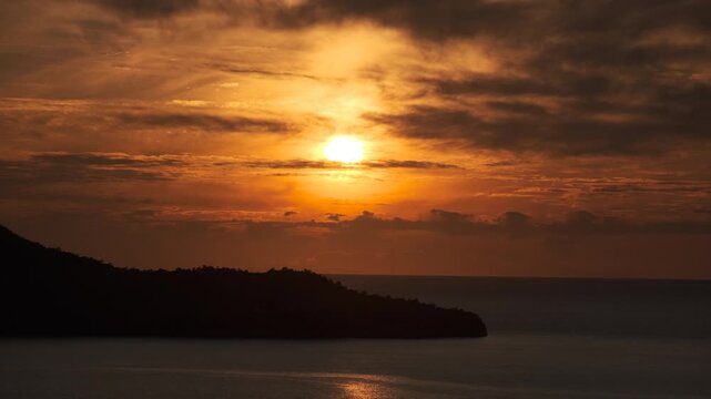 Aerial view of a tranquil sunset over the sea with silhouetted islands in Fethiye, Turkey, ab01