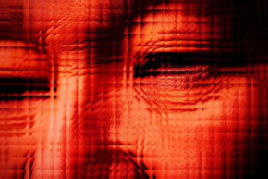 Close up of face with biometric and facial recognition technology in red