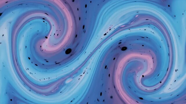 Abstract swirling blend of blue and pink, punctuated by scattered black specks