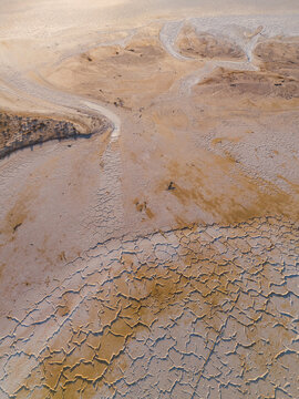 Aerial view of a cracked, parched earth revealing a mosaic of textures under the relentless sun, Lake Campion Nature Reserve, Western Australia, Australia.