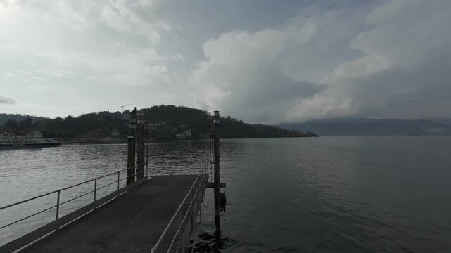 LAVENO MOMBELLO, ITALY: Ferry approaching the Terminal next to the lakeside promenade
