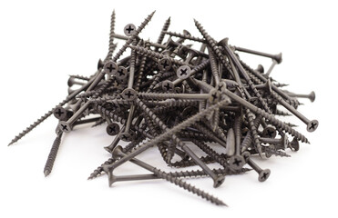 Pile of black metal screws for wood isolated on white background
