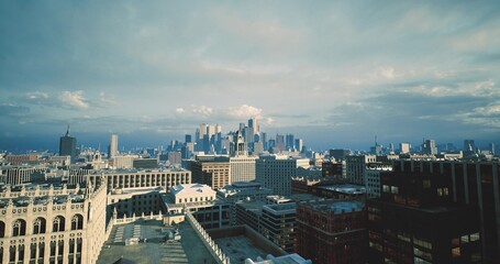 historic building facades meet modern skyline backdrop, ornate cornices and textured masonry visible, narrow rooftop lines, cultural district vibe with layered © icetray