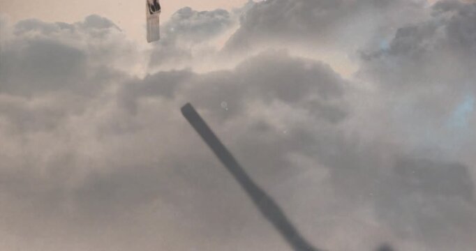 Metal crucifix pendant entering frame, pulling focus and revealing detail for faith marketing