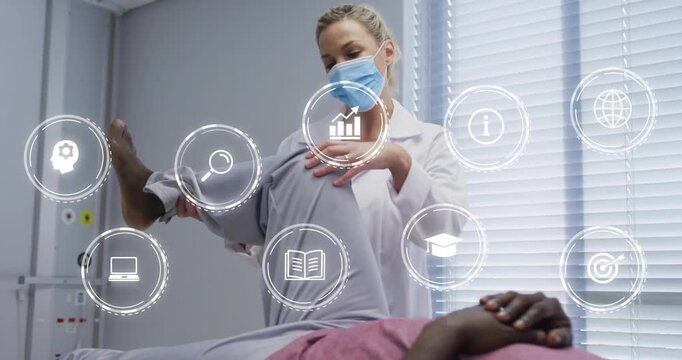 Clinician lifting patient right leg, testing ROM and initiating medical HUD with lens, graph