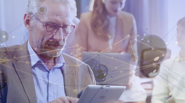 Mature man tapping tablet initiating network overlay, frame pulling back linking peers for business