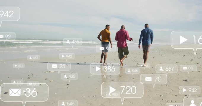 Three men walking shore, center checking phone showing, social icons clustering feet then fading