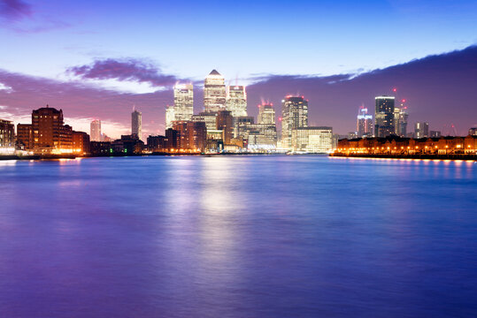 UK, London, skyline with Canary Wharf skyscrapers at dawn
