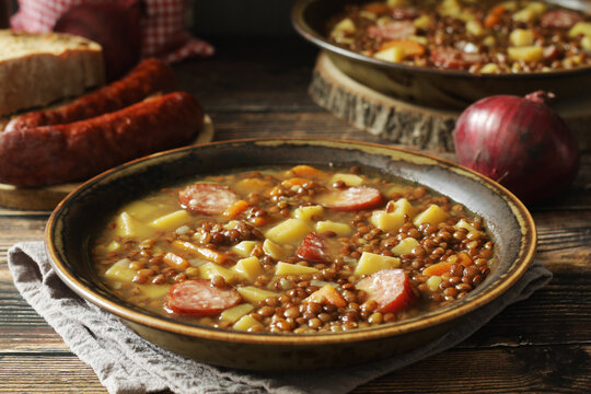 A bowl with traditional German Linsensuppe lentil soup in rustic style	
