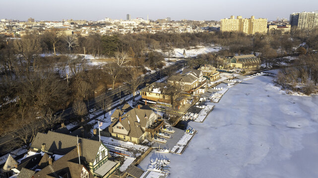 Aerial view of Boathouse Row's quaint buildings nestled by the Schuylkill River's icy embrace, Philadelphia, Pennsylvania, United States.