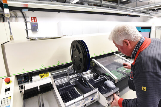 Man working on the manufacturing of circuit boards for the electronics industry
