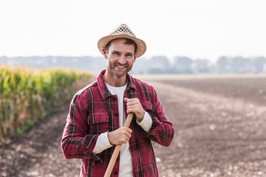Portrait of confident farmer on field