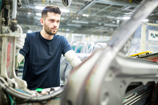 Man working in modern car factory