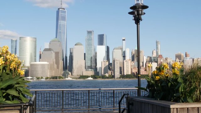 New York City Manhattan downtown financial district skyline, New Jersey Exchange Place, United States. Urban cityscape with skyscraper buildings, World Trade Center. J Owen Grundy park, Paulus Hook.