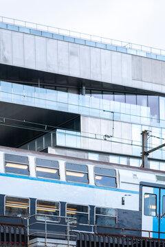 Contemporary Paris city mobility with train on modern rail route as transport infrastructure and architecture support daily commuting