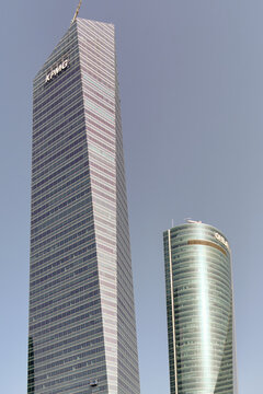 Financial District Growth In Madrid Spain Modern Architecture And Corporate Headquarters Of Kpmg And Other Businesses Against A Clear Blue Skyline