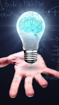 Vertical video: Faint notes appearing, open hand presenting hovering brain-bulb, illustrating math