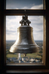 Obraz premium Ancient Silver Church Bell Hanging in a High Window Overlooking a Scenic Cityscape Landscape at Sunset, Historic Bronze Cathedral Bell with Detailed Ornate Engravings for Heritage and Religious Decor