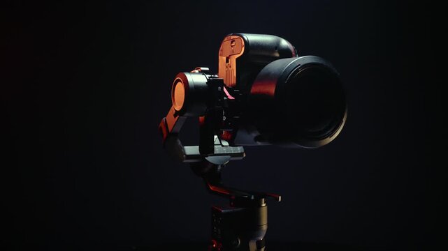 new electronic gyroscopic stabilizer for small SLR and mirrorless cameras and still cameras controlled via smartphone or joystick