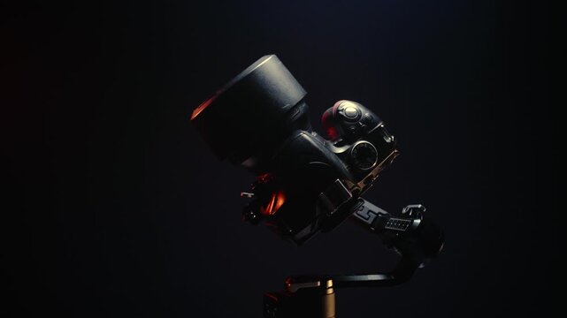 new electronic gyroscopic stabilizer for small SLR and mirrorless cameras and still cameras controlled via smartphone or joystick