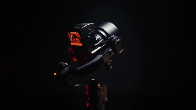 new electronic gyroscopic stabilizer for small SLR and mirrorless cameras and still cameras controlled via smartphone or joystick