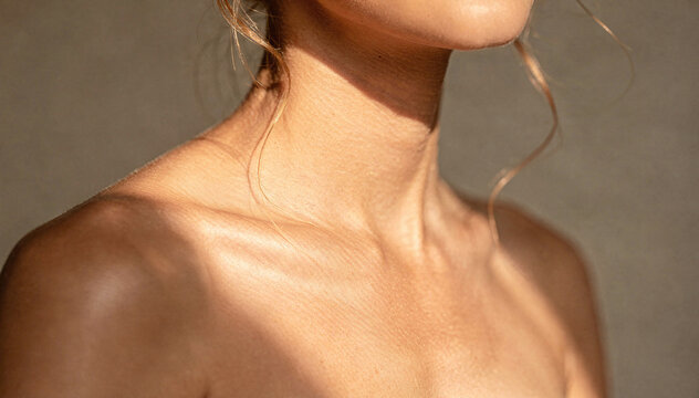 Minimalist body detail with warm light and shadow texture on skin