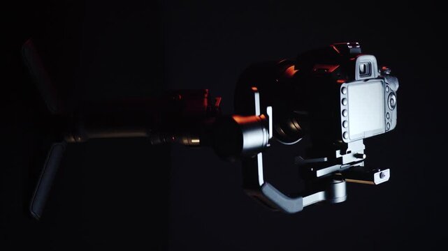 vertical video new electronic gyroscopic stabilizer for small SLR and mirrorless cameras and still cameras controlled via smartphone or joystick