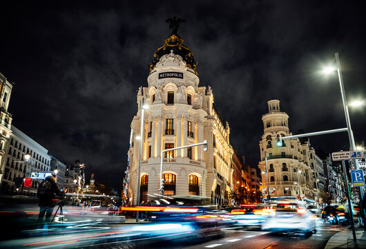 Night cityscape of Gran Via Madrid showing Metropolis Building and traffic