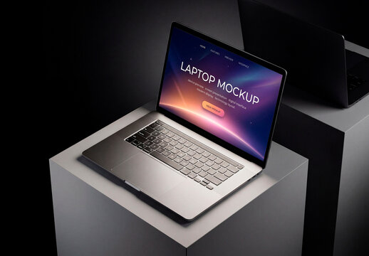 Modern laptop with blank screen on dark pedestal product display