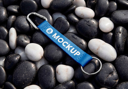 White fabric keychain strap with metal clip on black and white stones