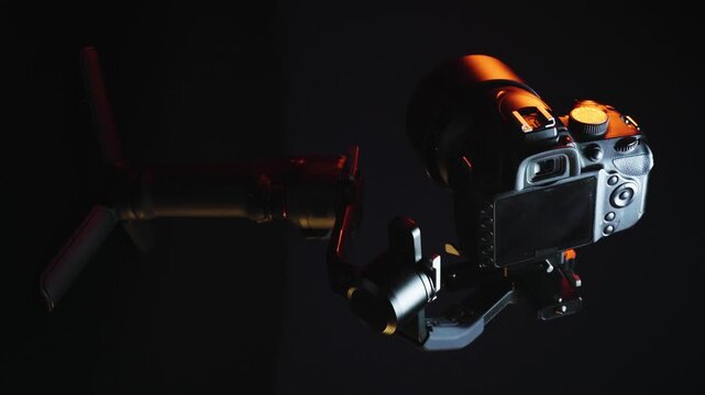 vertical video new electronic gyroscopic stabilizer for small SLR and mirrorless cameras and still cameras controlled via smartphone or joystick