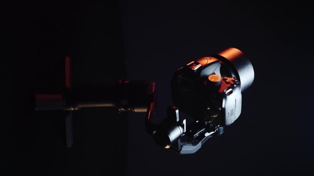 vertical video new electronic gyroscopic stabilizer for small SLR and mirrorless cameras and still cameras controlled via smartphone or joystick