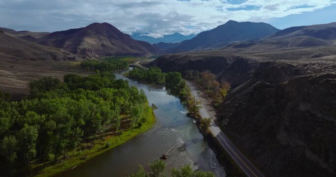 Winding Salmon River and Highway 93 through mountain valley in Idaho