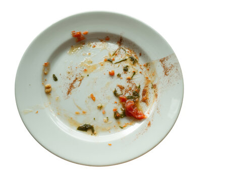 Dirty white plate with food remnants dirty plate leftovers