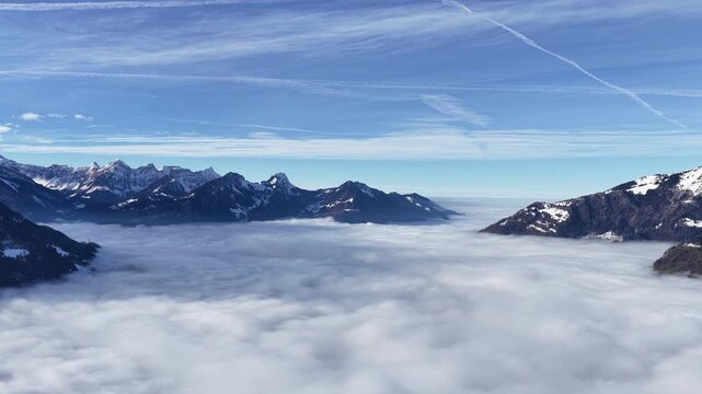 Vast mountain horizon above soft clouds evoking silence, reflection and a sense of limitless inner space.