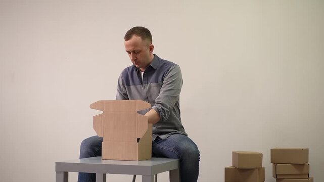 Product packaging. Cardboard box. Slow motion video. . High quality 4k footage