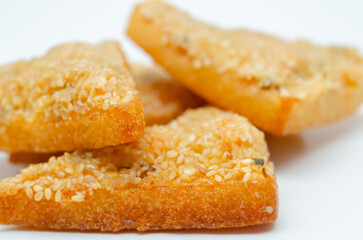 Golden-brown toast crumbs sit on a plain white plate