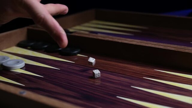 Slow Motion Close-up of Rolling Backgammon Dice in Mid-Air, Gaming Action