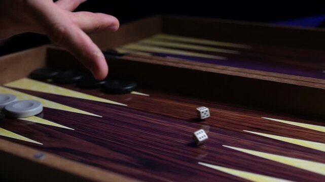 Slow Motion Close-up of Dice Rolling on a Backgammon Board, Chance and Strategy in Action